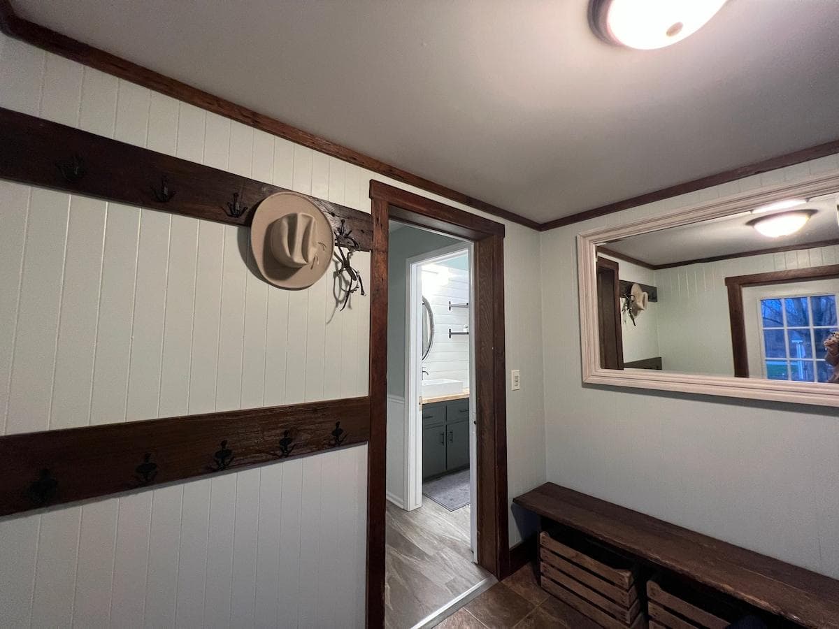 Home entry way, space for coats and bench for putting on and removing shoes.